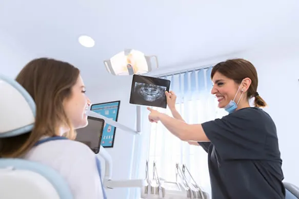 dental assistant showing xray