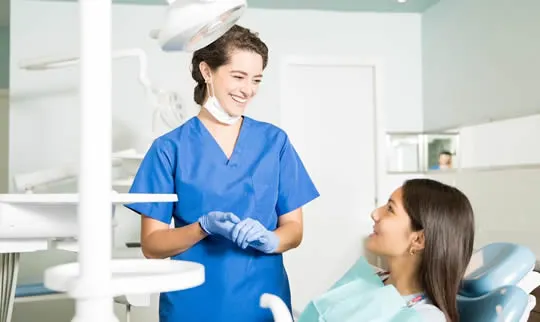 orthodontist assistant smiling at patient
